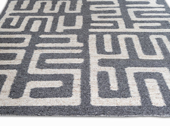 Flatweave Area rug with geometric pattern in while and dark grey colors