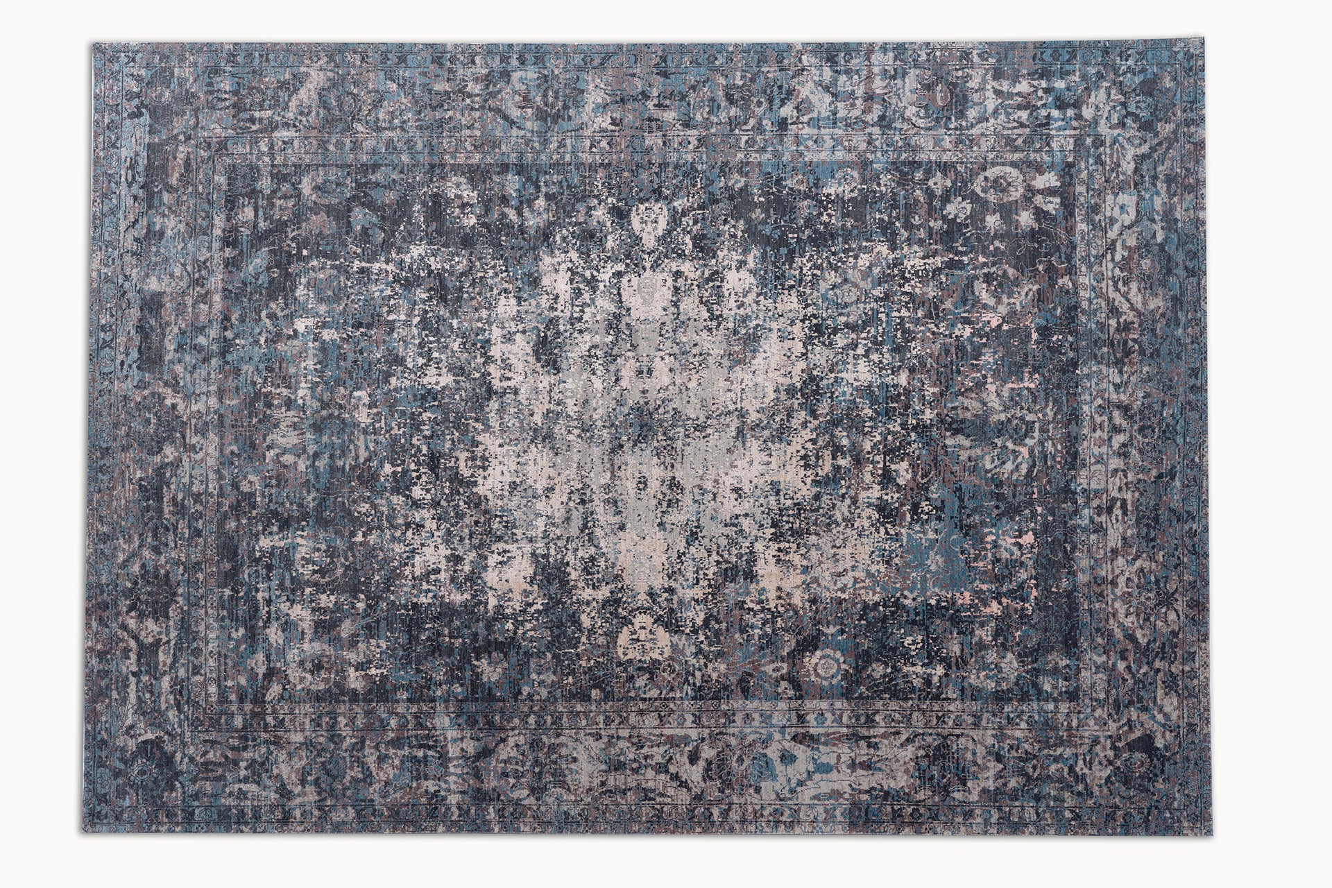 midcentury modern area rug with intricate patterns in blue, beige and dark grey colors