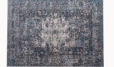 midcentury modern area rug with intricate patterns in blue, beige and dark grey colors