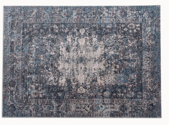 midcentury modern area rug with intricate patterns in blue, beige and dark grey colors