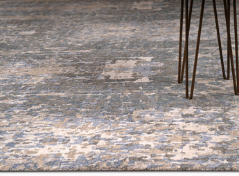 living room rug with intricate pattern in blue, grey and brown shades