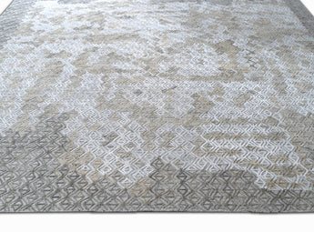 handmade are rug with simple patterns in grey and white colors - on the floor view