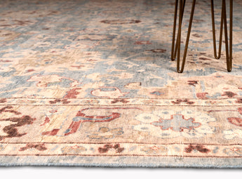 traditional are rug with floral patterns and multiple colors