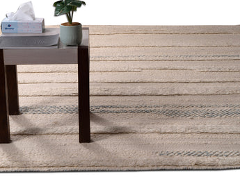 beige-flat-weave-wool-area-rug-on-floor