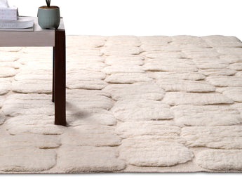 Plush White area rug with bulging patterns