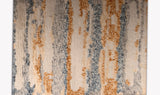 Plush area rug with bulging patterns in rust , blue and white colors